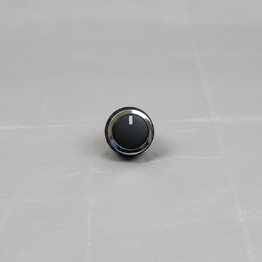 OEM HVAC Temp Control Knob on grey wrinkled craft paper background