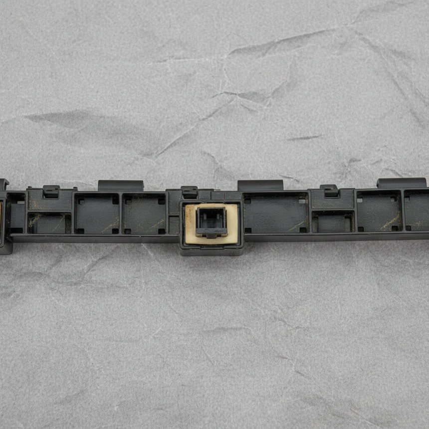 Close-up of Honda OEM Rear Driver Side Bumper Bracket Retainer for 2017-21 Civic FK Hatchback