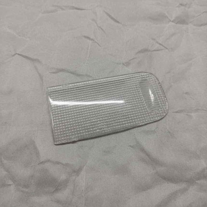 Honda Pilot Passport Ridgeline front dome lens on light grey wrinkled kraft paper background, packaging removed