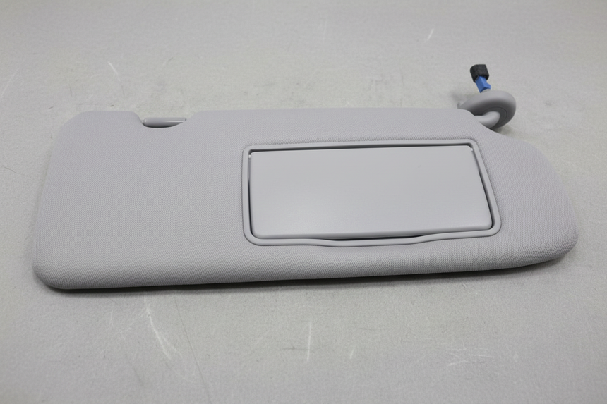 2020-2022 Honda CR-V Passenger Side Front Sun Visor on grey wrinkled craft paper background