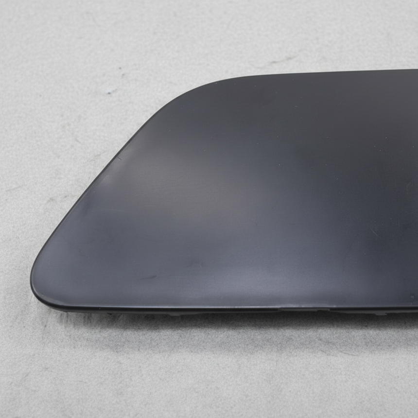 Nissan LEAF OEM Front Bumper Tow Bracket Cover - Macro Middle 1