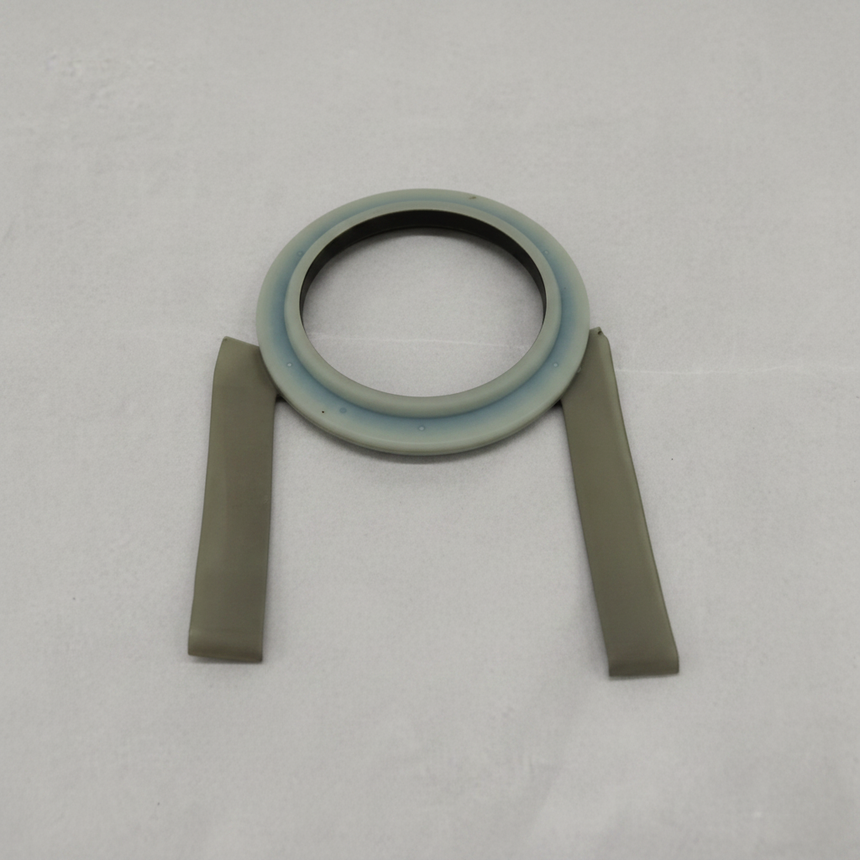 Acura MDX ZDX front strut bearing on light grey wrinkled kraft paper background, packaging removed