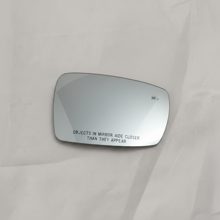 OEM Heated Passenger Mirror Glass on grey wrinkled craft paper background