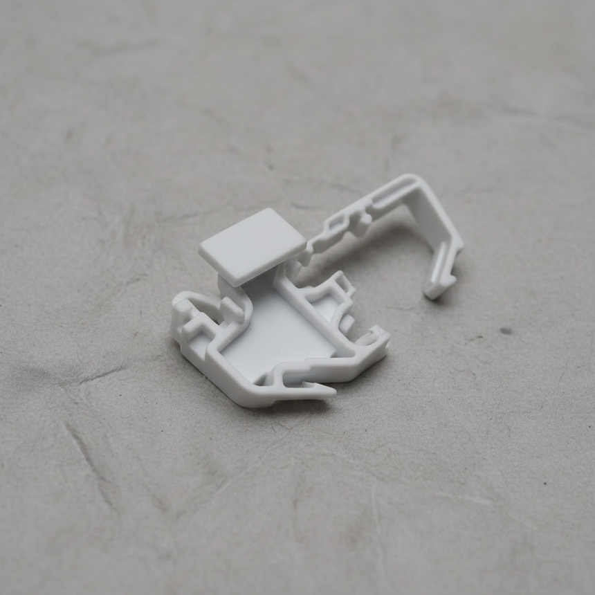Top macro crop of torsion spring clip on light grey wrinkled kraft paper background