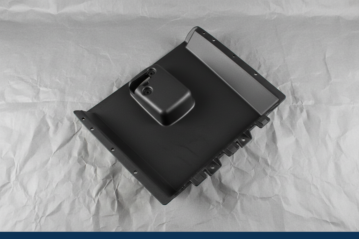 2008-2024 Chevrolet Express/GMC Savana Dashboard Lower Compartment Door OEM - detail view on kraft paper