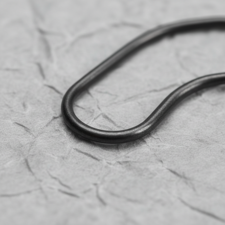 Lower-middle macro crop on light grey wrinkled kraft paper background