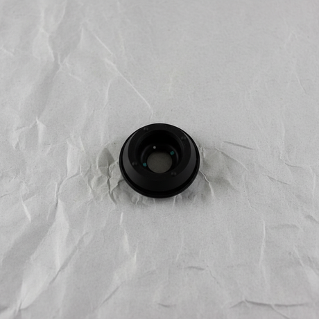 Full view of rear wiper motor seal on light grey wrinkled kraft paper