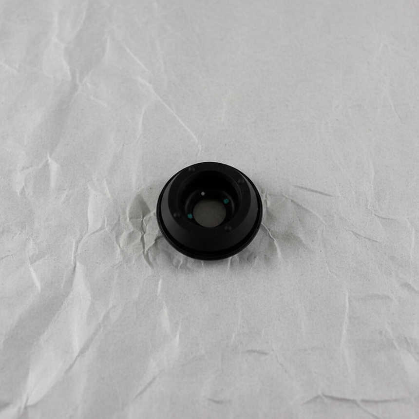 Full view of rear wiper motor seal on light grey wrinkled kraft paper