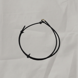 OEM Windshield Washer Hose on grey wrinkled craft paper background
