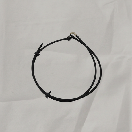 OEM Windshield Washer Hose on grey wrinkled craft paper background