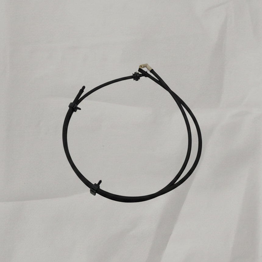 OEM Windshield Washer Hose on grey wrinkled craft paper background