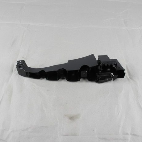 Top macro crop of Dodge Charger rear bumper fascia support bracket on light grey wrinkled kraft paper