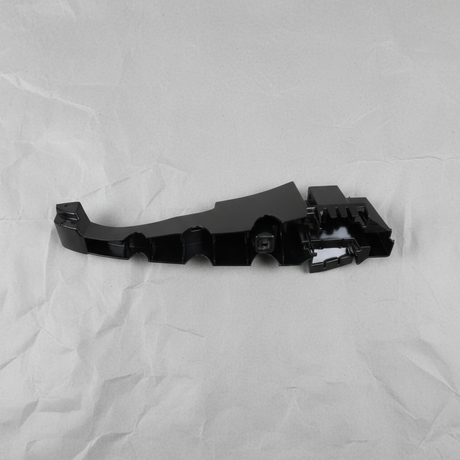 Full view of Dodge Charger rear bumper fascia support bracket on light grey wrinkled kraft paper