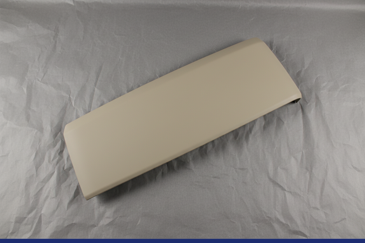 2015-2017 Ford Expedition Lincoln Navigator Driver Side Front Seat Track Cover Dune OEM - Rotated 27 degrees on gray kraft paper background