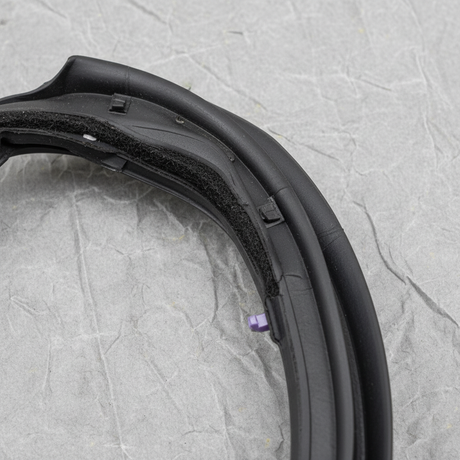 Close-up of Nissan OEM Passenger Side Rear Door Mounted Weatherstrip for 2015-19 Versa