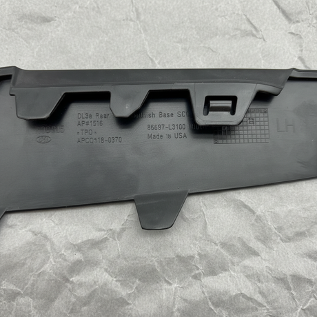 Close-up alternate angle of Kia OEM Rear Driver Side Bumper Insert Glossy Black