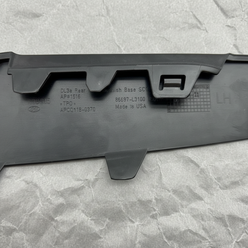Close-up alternate angle of Kia OEM Rear Driver Side Bumper Insert Glossy Black