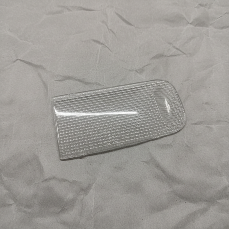 Honda Pilot Passport Ridgeline front dome lens on light grey wrinkled kraft paper background, packaging removed