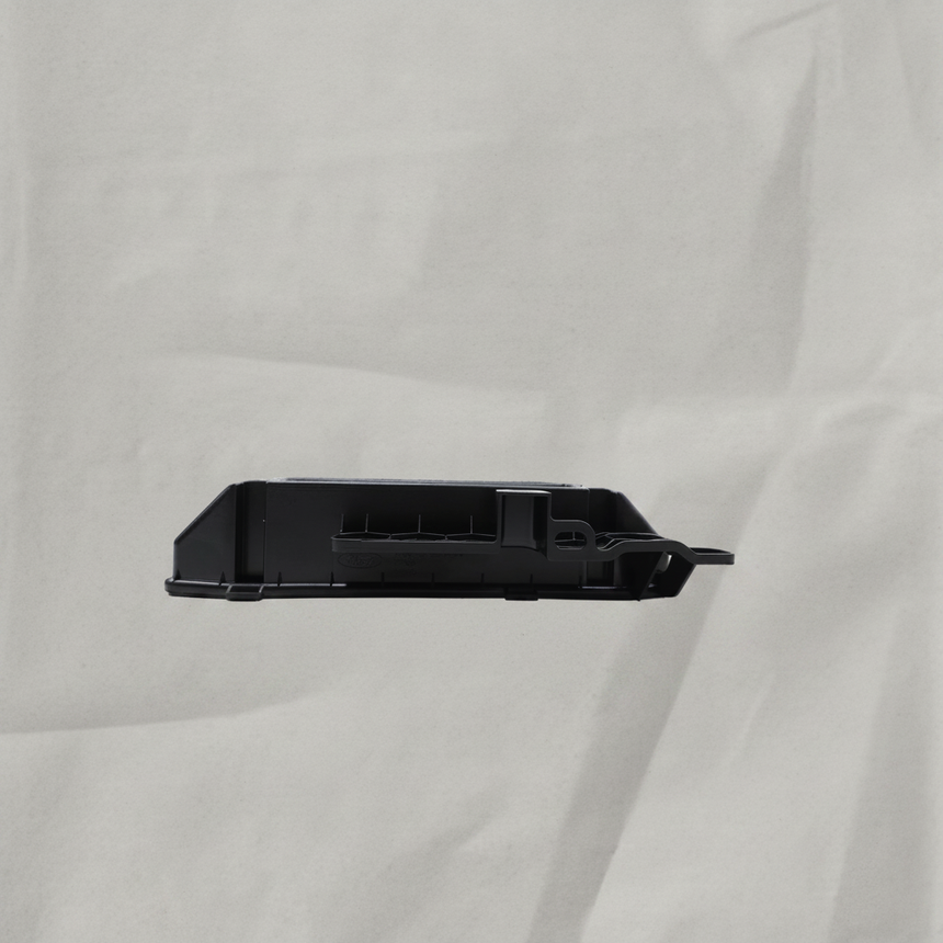 2025 Ford F-150 Engine Control Module Bracket OEM - gray kraft paper background