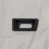 OEM License Plate Lamp Bezel on grey wrinkled craft paper background