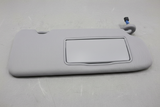 2020-2022 Honda CR-V Passenger Side Front Sun Visor on grey wrinkled craft paper background