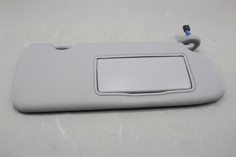 2020-2022 Honda CR-V Passenger Side Front Sun Visor on grey wrinkled craft paper background