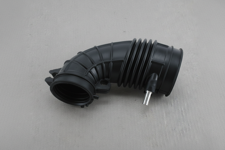 2005-2006 Honda CR-V Air Cleaner Intake Hose Tube OEM Genuine - rotated 30 degrees on gray kraft paper