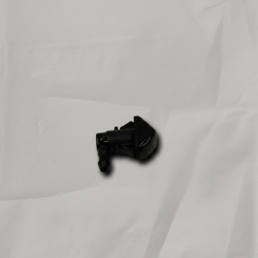 Acura MDX driver side front windshield washer nozzle on light grey wrinkled kraft paper background, packaging removed