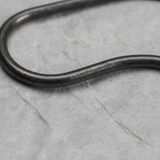 Bottom macro crop on light grey wrinkled kraft paper background