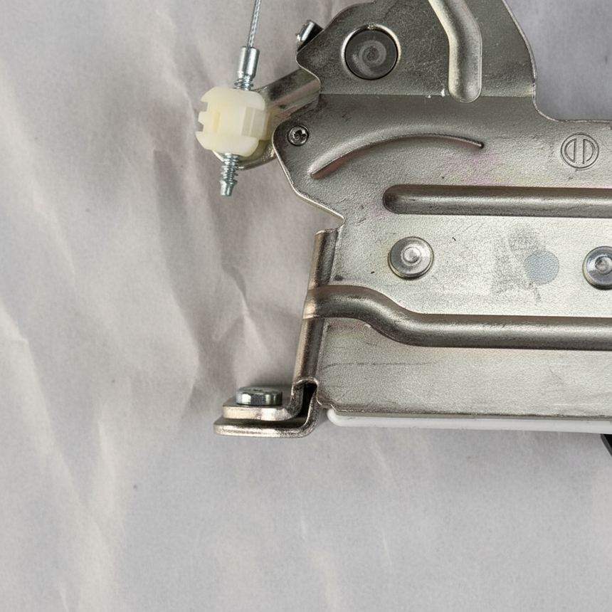 Bottom macro crop of sliding door latch angle 2 on light grey wrinkled kraft paper