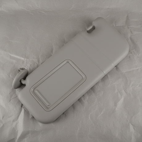 2009-2010 Toyota Corolla Driver Side Sun Visor Brown OEM - rotated 30 degrees on kraft paper background