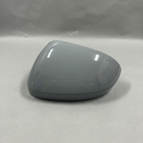 2024-2025 Nissan Rogue Driver Side Door Mirror Cover - Front view gray primer on kraft paper