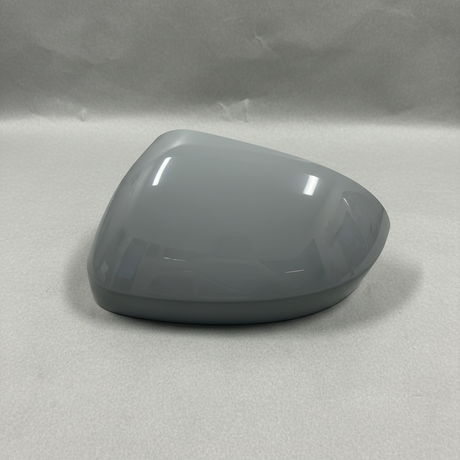 2024-2025 Nissan Rogue Driver Side Door Mirror Cover - Front view gray primer on kraft paper