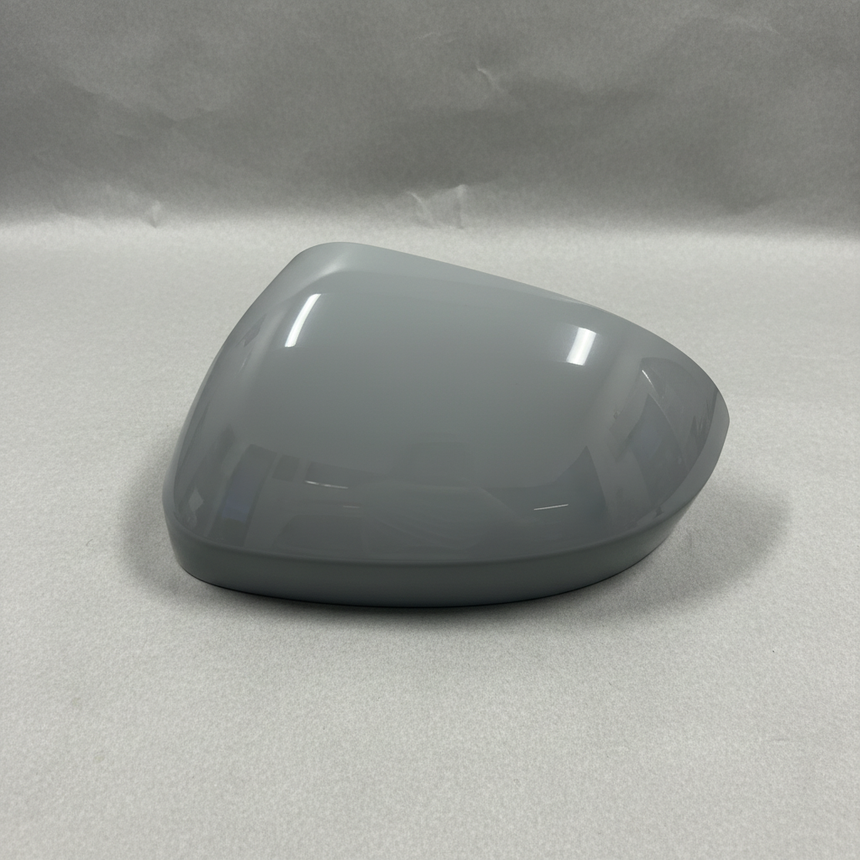2024-2025 Nissan Rogue Driver Side Door Mirror Cover - Front view gray primer on kraft paper