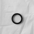 Transfer case input shaft seal on grey wrinkled kraft paper background
