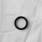 Transfer case input shaft seal on grey wrinkled kraft paper background