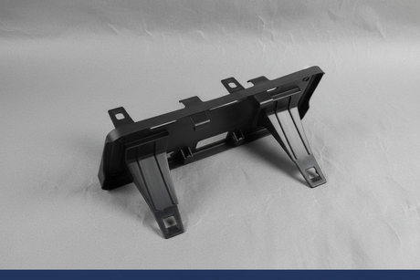 2023-2025 Ford F350 F450 Dually Front License Plate Bracket OEM - Detail view on gray kraft paper