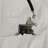 Full view of sliding door latch on light grey wrinkled kraft paper