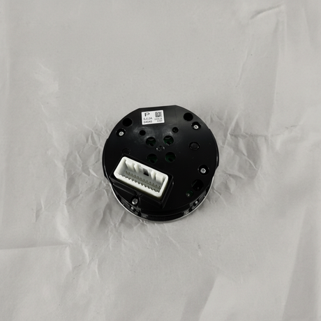 Full view of center control switch AWD angle 2 on light grey wrinkled kraft paper