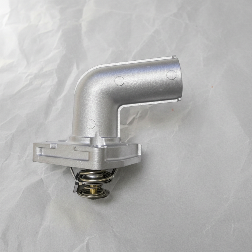 2001-2010 Nissan Altima Maxima Murano Quest 3.5L Thermostat OEM on grey wrinkled craft paper