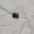 Oil filter stud on grey wrinkled kraft paper background