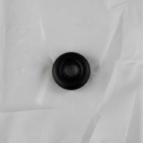 Full view of rear wiper motor seal angle 2 on light grey wrinkled kraft paper