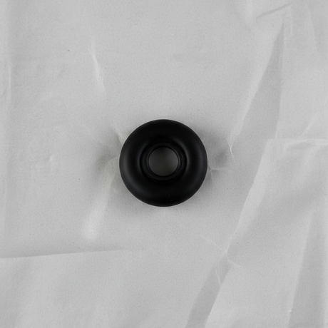 Full view of rear wiper motor seal angle 2 on light grey wrinkled kraft paper