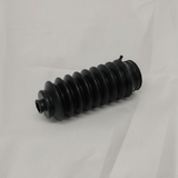 Honda CR-V Civic driver side rack pinion bellows on light grey wrinkled kraft paper background, packaging removed