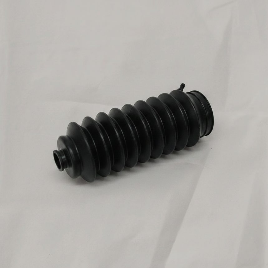 Honda CR-V Civic driver side rack pinion bellows on light grey wrinkled kraft paper background, packaging removed