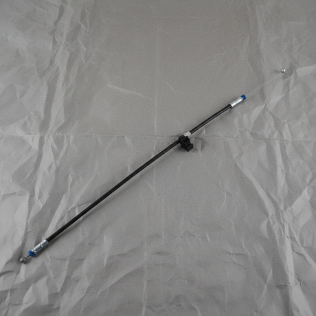 2018-2022 Honda Accord Genuine OEM hood release cable 74140-TVA-A01 rotated view on gray kraft paper