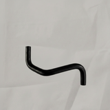 Transmission oil cooler hose on grey wrinkled kraft paper background