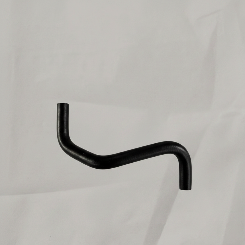 Transmission oil cooler hose on grey wrinkled kraft paper background
