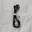Full view of rear park assist camera wiring harness on light grey wrinkled kraft paper