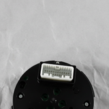 Bottom macro crop of center control switch AWD angle 2 on light grey wrinkled kraft paper